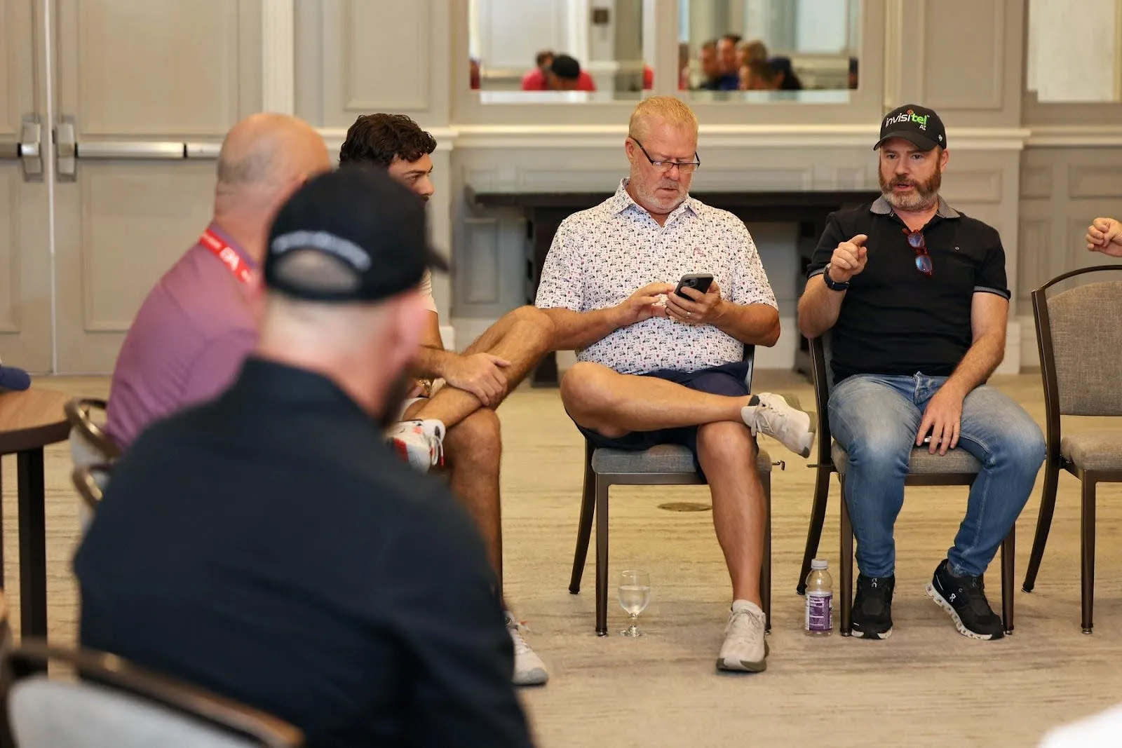 Home 3 Mike Weiss in strategic business discussion with industry leaders