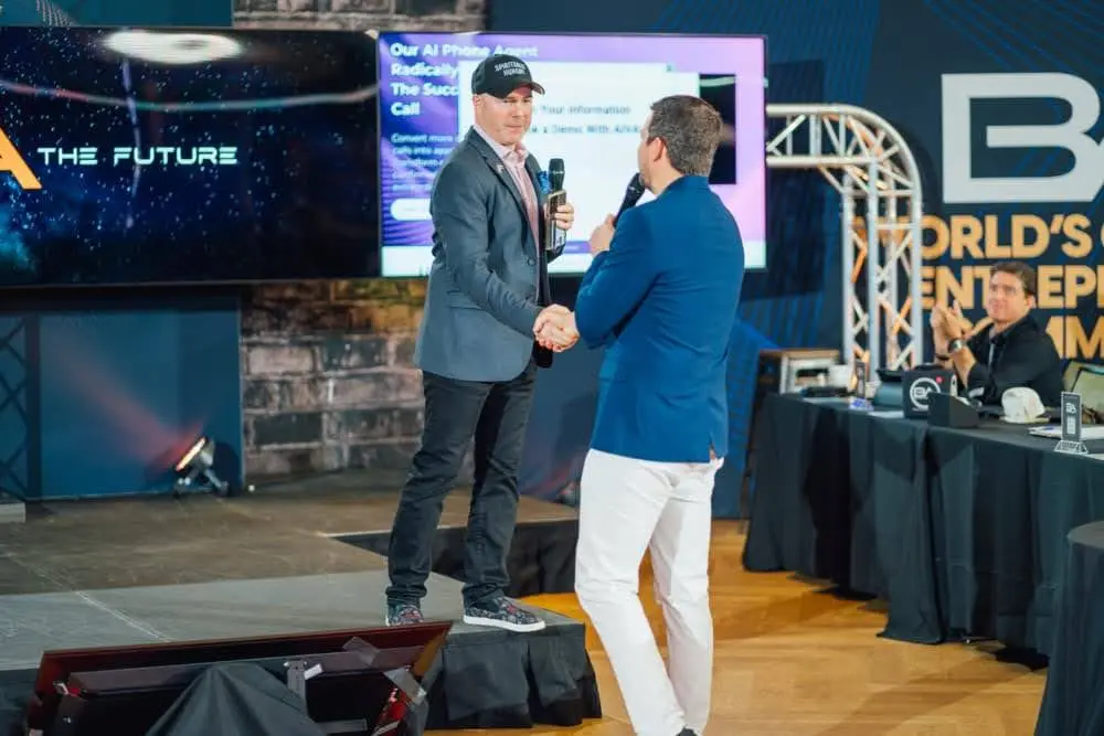 Home 2 Mike Weiss networking and collaborating with business partners on stage